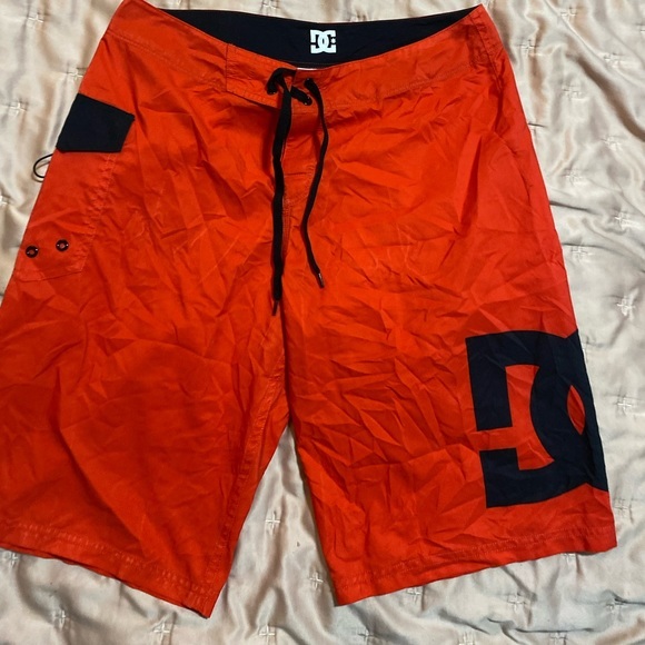 DC Other - Dc red and black men’s swim trunks size medium